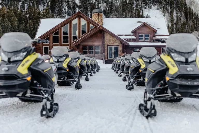 snowmobiles lined up outside nova guides